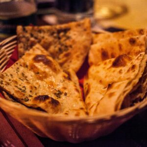 Close-up of traditional Indian flatbreads in a basket
