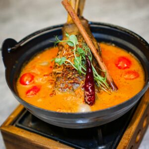 Delicious lamb shank curry with vibrant spices and herbs