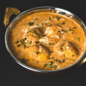 Flavorful dum aloo curry served in a traditional kadai