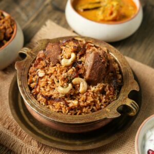 Tantalizing Indian biryani with tempting side dishes captured in Chennai
