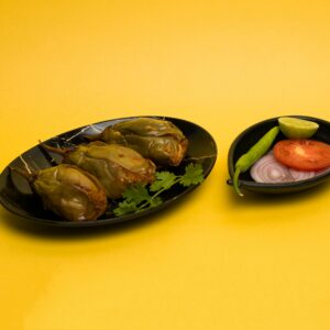 Close-up of stuffed eggplant dish with fresh garnishes